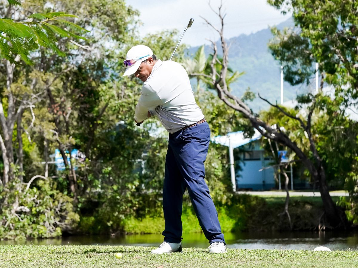 Masters man hitting golf ball