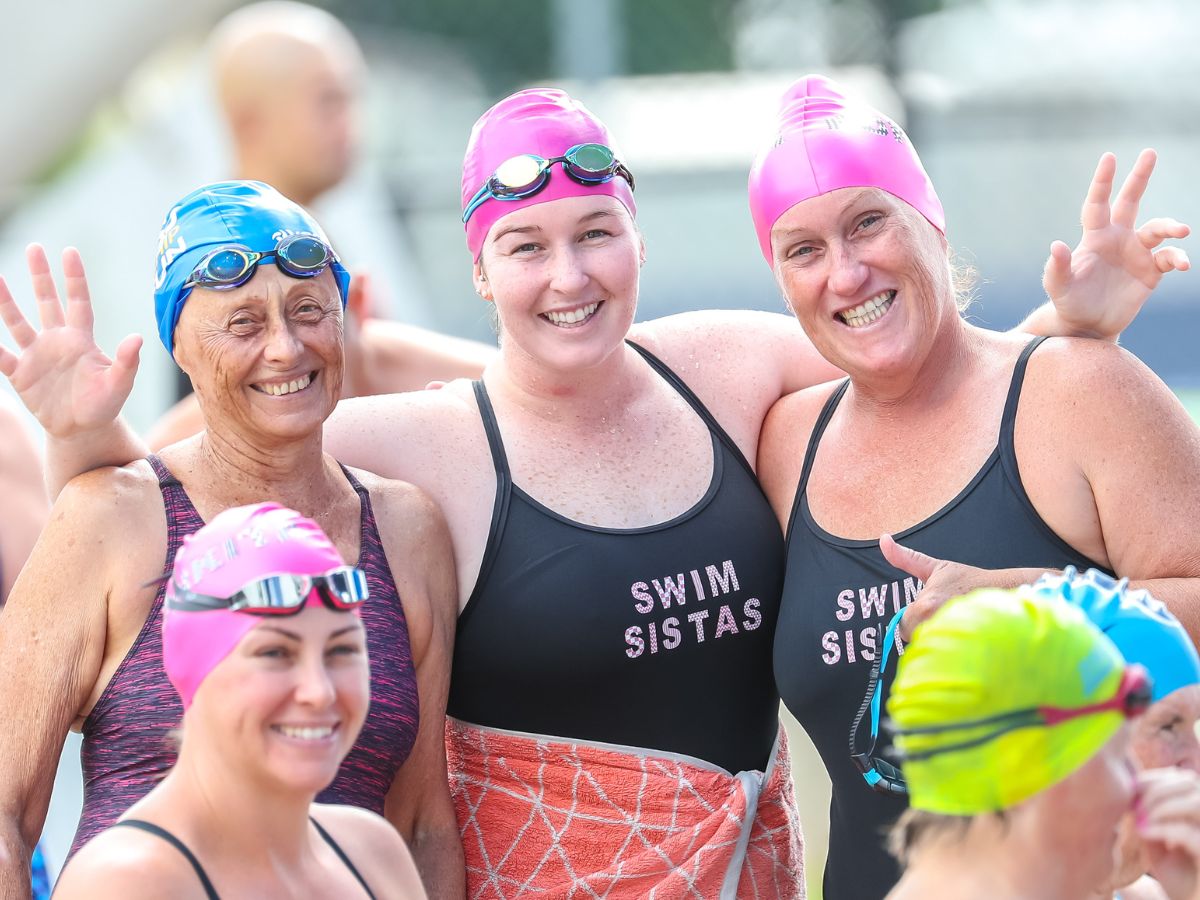 Group of female masters swimmers posing for a photo