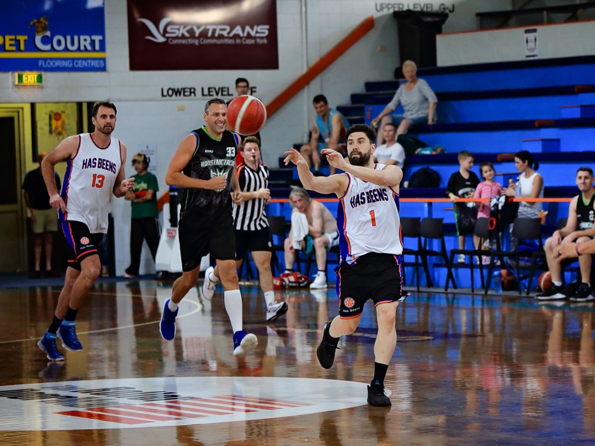 Masters man throwing basketball to teammate